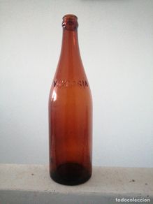 Colecionismo de cervejas: Botella de cerveza VICTORIA MÁLAGA de 66 cl relieve del año 1928